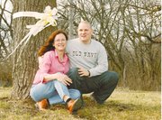 The worn yellow ribbon tied around the tree in Shirley Gustafson's
front yard is but a small symbol of her support for her sons. Two
of her three sons have served in Iraq, including her son, David
Gustafson, pictured beside her. Shirley (Jepson) Gustafson lives
near Lansing, but grew up in the Jarbalo area and is a 1967
graduate of Tonganoxie High School.