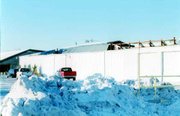 The winter storm dumped enough ice on the roof of Masson's
greenhouse in Linwood to collapse this section.
