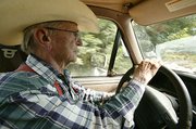 Though retired for five years, John Smith still makes daily rounds
of Tailgate Ranch, checking on cattle.