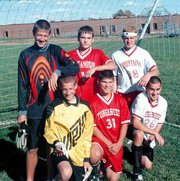 Seniors Matt Tate, Dustin Schultz and Kevin Colon (standing) are
teammates of brothers and freshmen Michael Tate, Travis Schultz and
Chris Colon.