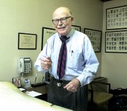 Dr. Philip Stevens in his tidy Tonganoxie office talks about
changes in the medical profession during his nearly 48 years of
practice. "When I started my practice, half of our patients were
farmers. ... Now it's down to one or two percent," he said.