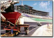 Driving toward completion of Kansas Speedway, workers are
installing the second layer of the asphalt track this week. Sunday,
the first layer of track received its first test drive by Indy
Racing Northern Light Series driver Billy Boat. Track officials say
that Boat, who drove an Indy car at speeds in excess of 130 mph,
was pleased with the quality of the track. Drivers will also check
the quality of the second and third layers of asphalt.