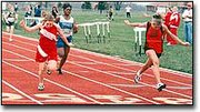 Meghan Needham crosses the finish line during a preliminary heat of
the 100-meter dash at Friday's Basehor-Linwood Invitational. Both
the girls and the boys teams took home team championships.