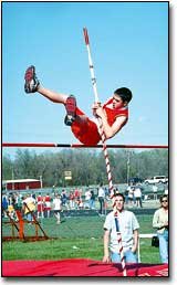 Clay Lamb doesn't quite make it over the bar during a pole vault
competition last Wednesday at the Tonganoxie Junior High School
track meet. Both the seventh- and the eighth-grade team took first
at the meet.