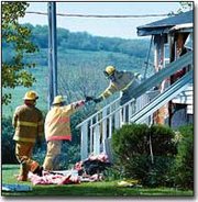 Firefighters put out the last of a fire Thursday afternoon in a
double wide mobile home at Paradise Trailer Park. Firefighters from
Tonganoxie Township, the city of Tonganoxie, Reno Township and
Stranger Township responded.