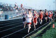 McLouth's Matt Scarlett and Tonganoxie's John Gossett, Andy Kolman
and Michael Tate compete in the 1,600 Friday at the Eudora
Invitational.