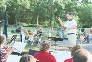 Tonganoxie band director Charles VanMiddlesworth directs the
Tonganoxie community band at the July 2 concert in the park.